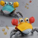 Pełzający uciekający krab interaktywny dźwięk muzyka gra czujnik